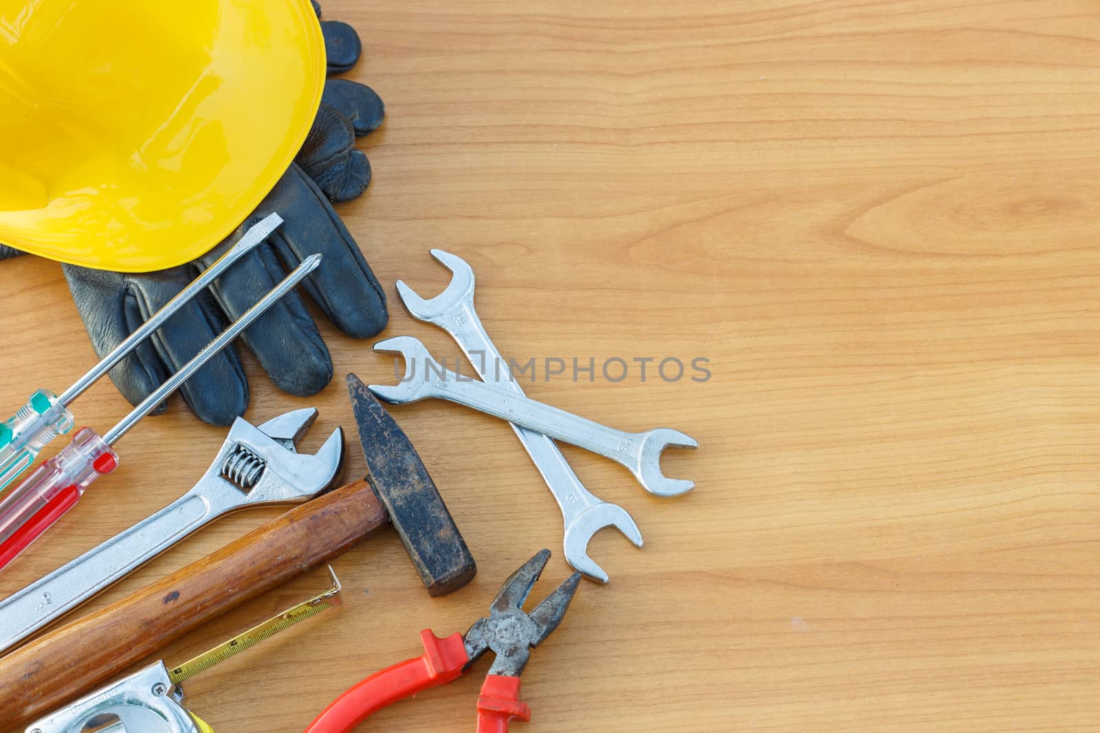 Closeup of assorted work tools on wood