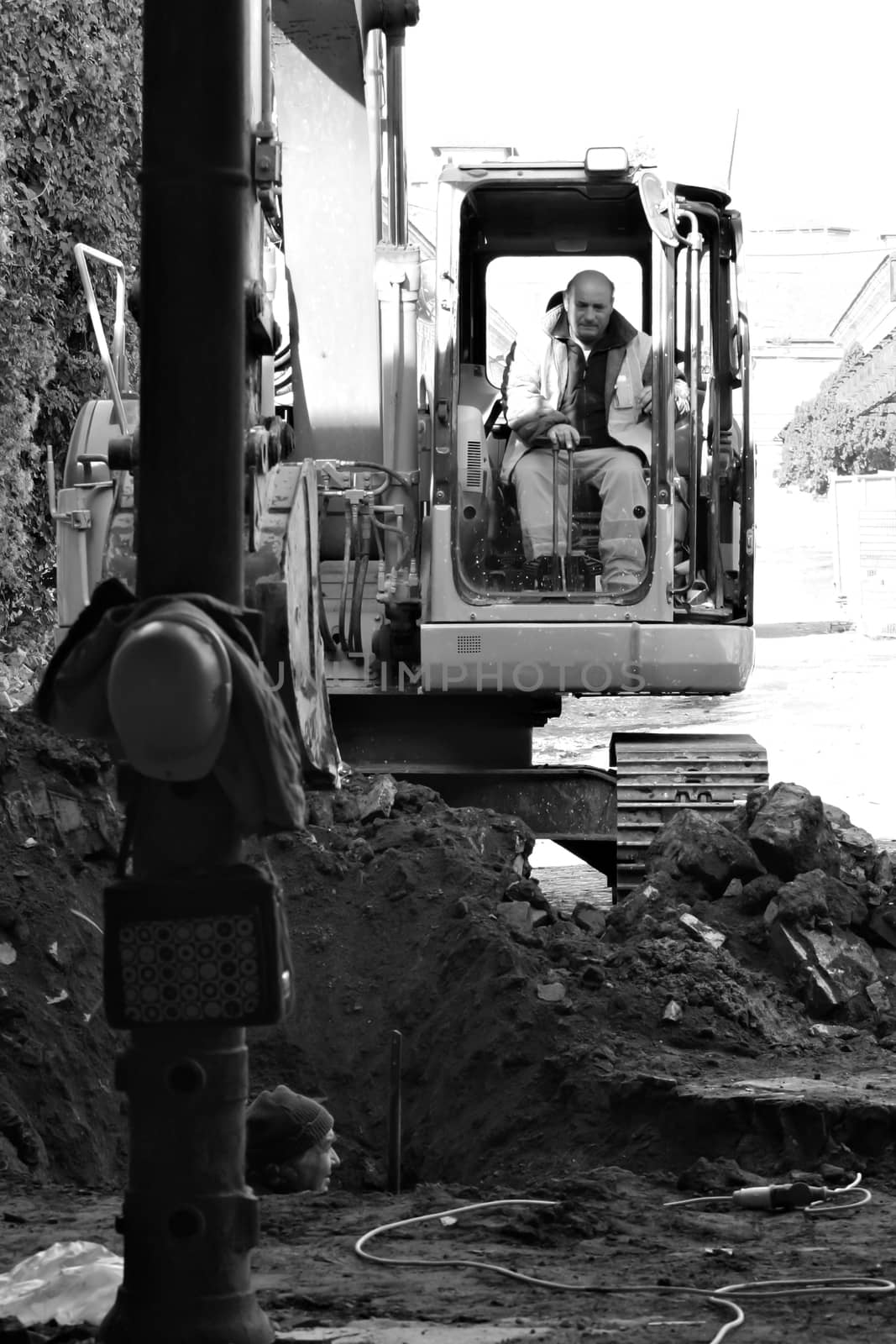 Workers excavating hole in yard by Mag6619