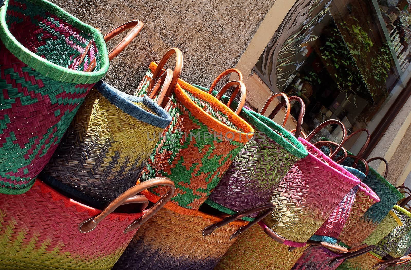 Bulk multi colored lady bags showed on the street