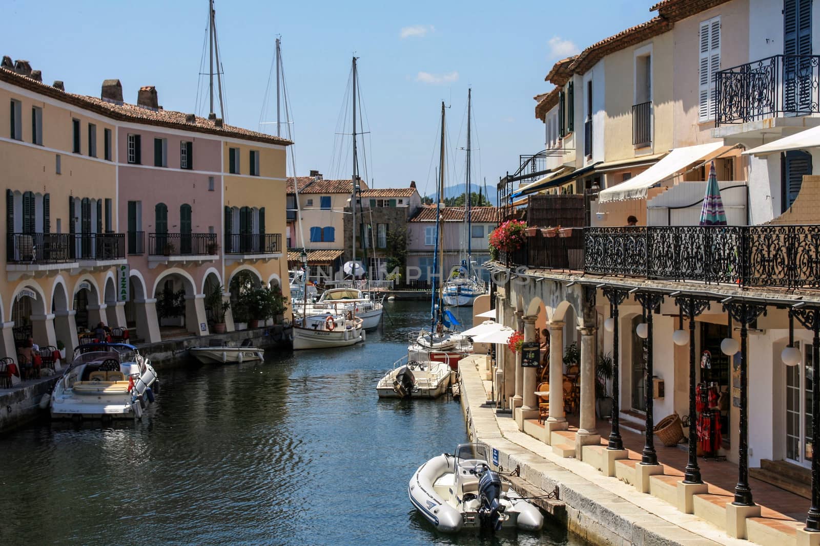 Boats and sails docked at marina port in French Riviera