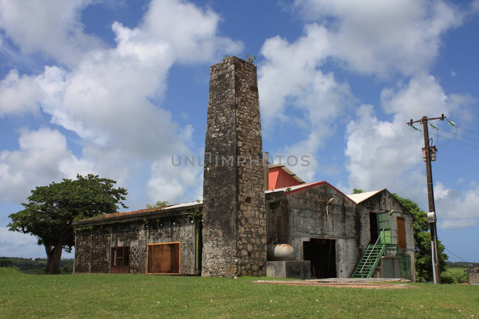 Abandoned rhum factory stands under the sun in Marie Galante