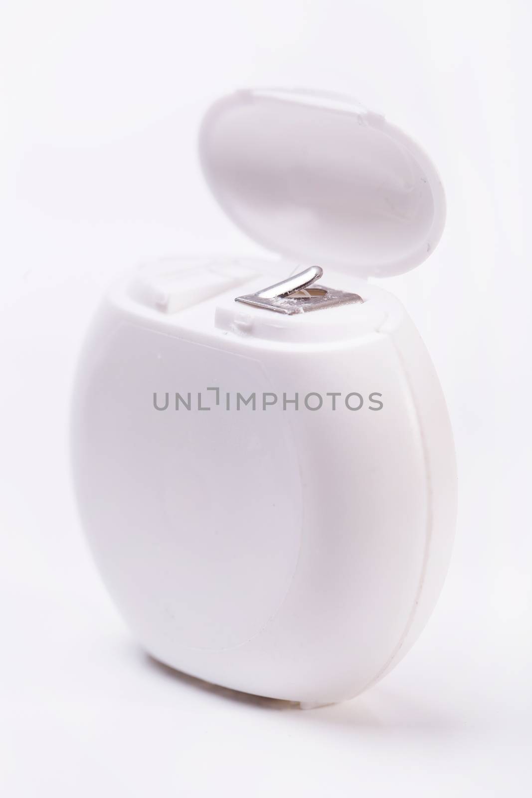 Dental floss on a white background