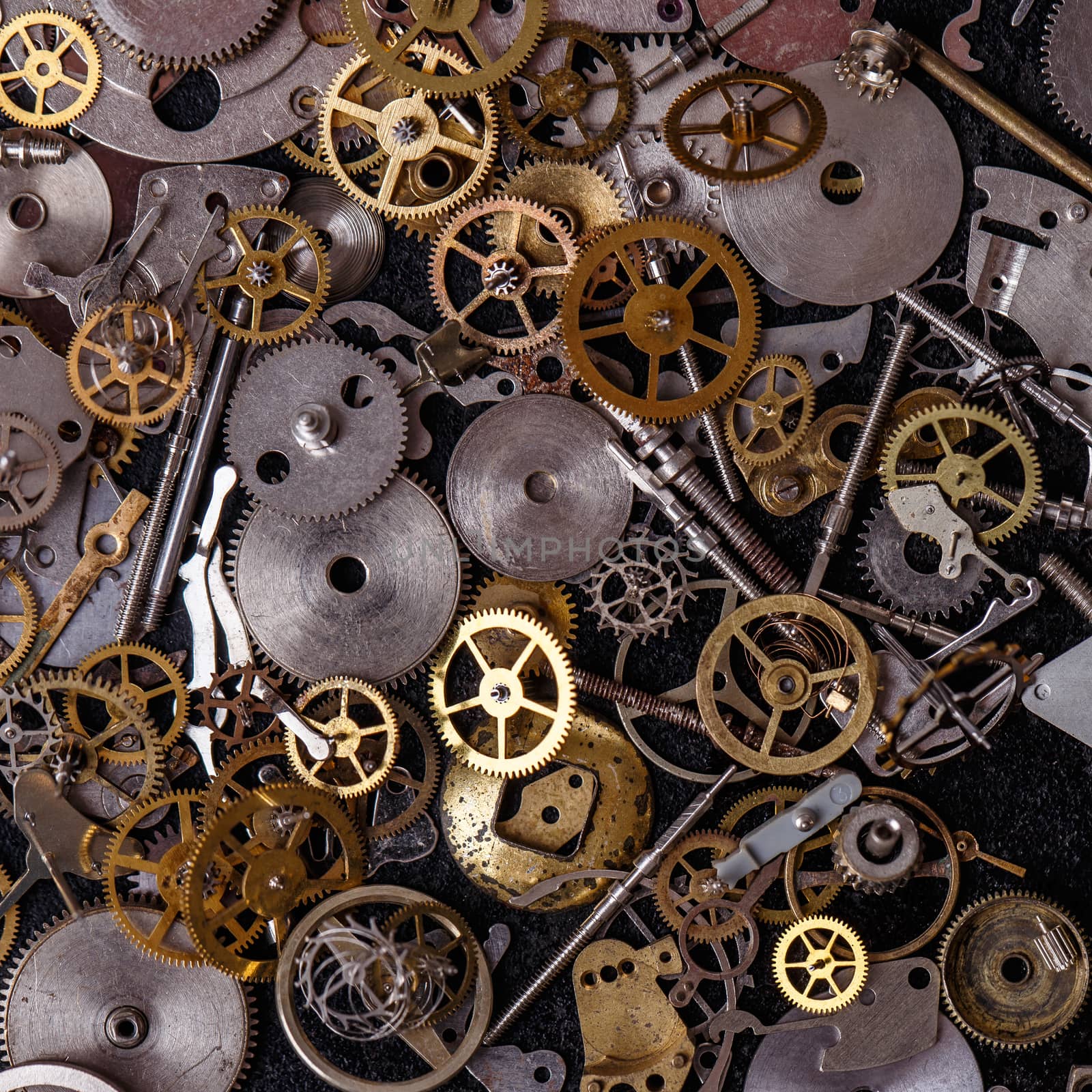 Details, technology. Heap of small gears on the table