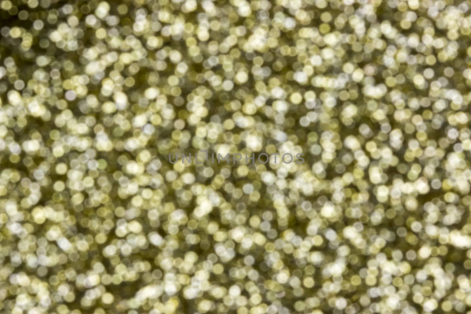 Bright defocused gold light background of Christmas and New Year
