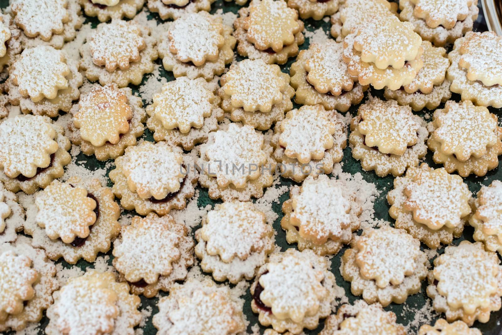 Christmas gingerbread cookies, filled with jam and sprinkled with powdered sugar