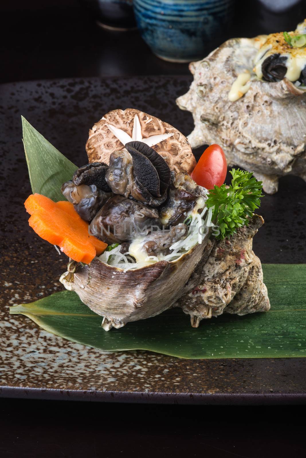 japanese cuisine. grilled shell fish on background
