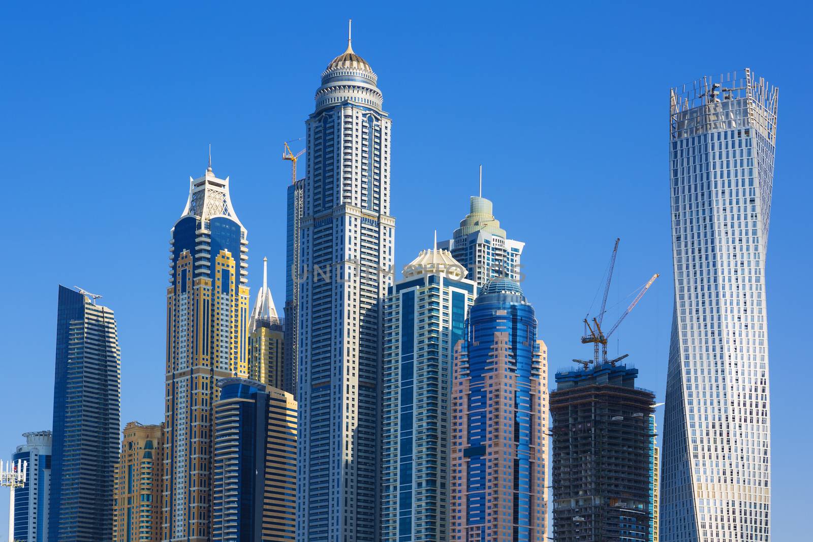 Skyscrapers at jumeirah beach in Dubai by vwalakte