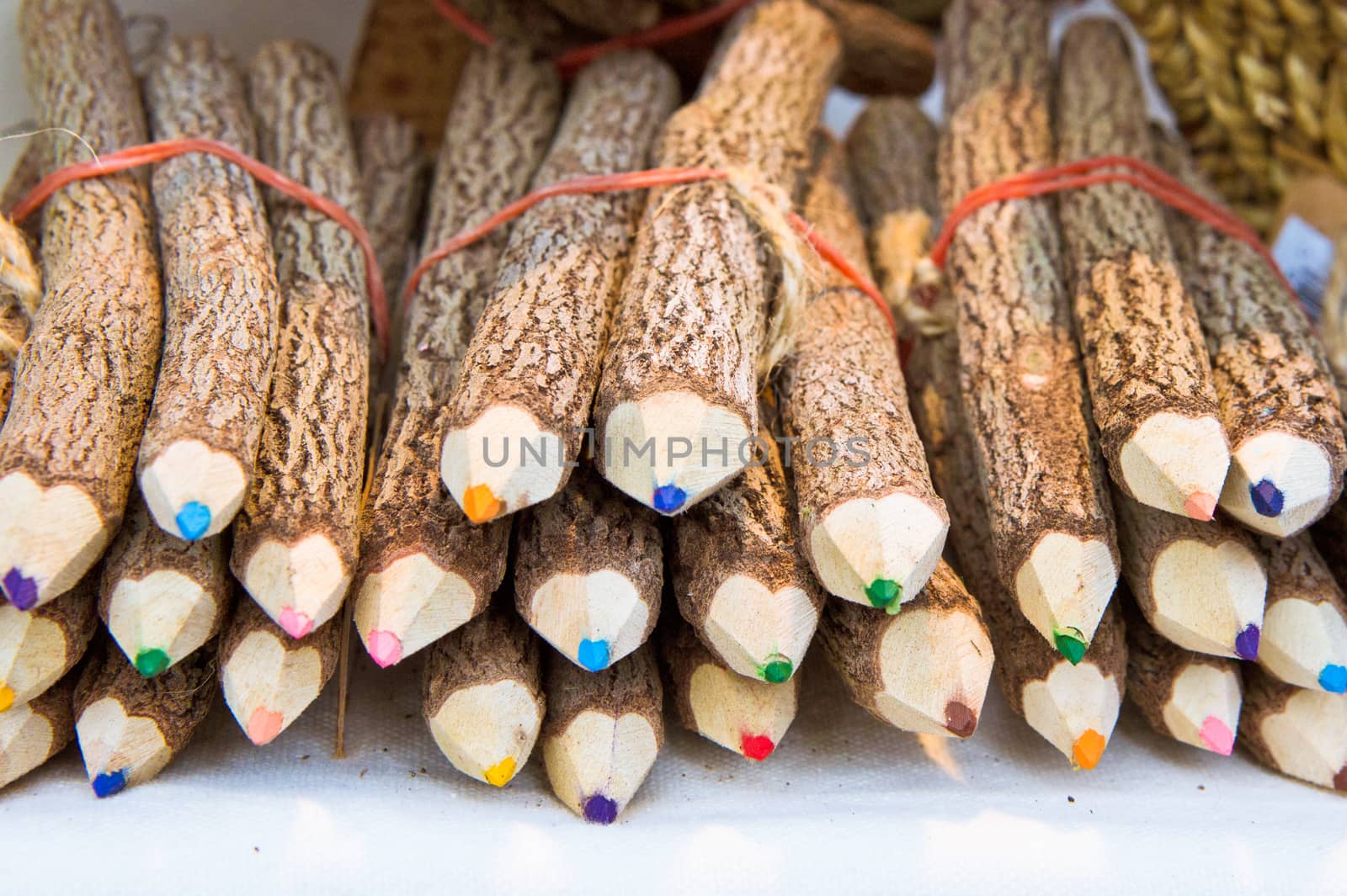 Selection of colorful pencils made out of wooden twigs