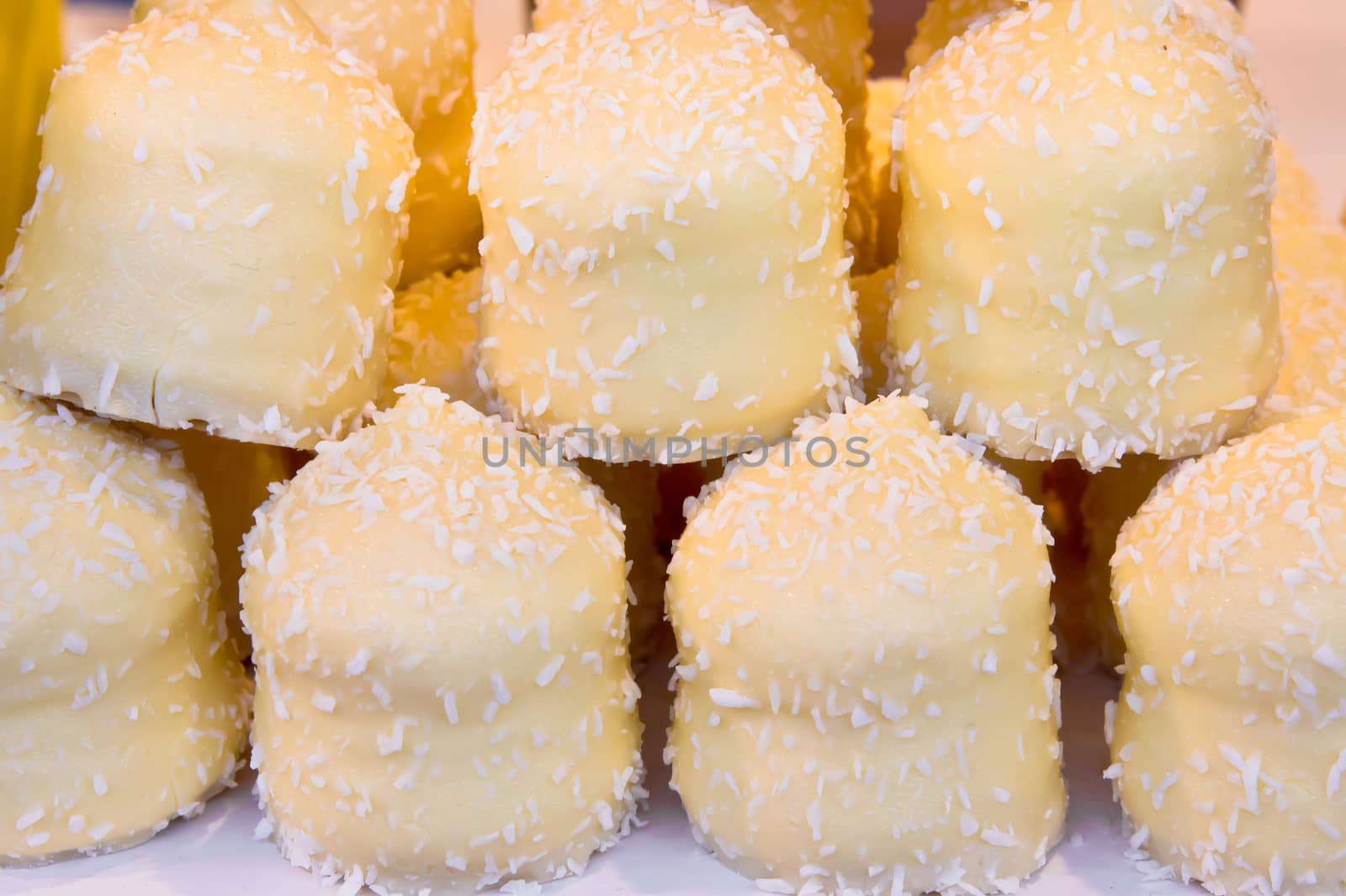 White chocolate sweets dusted with dessicated coconut