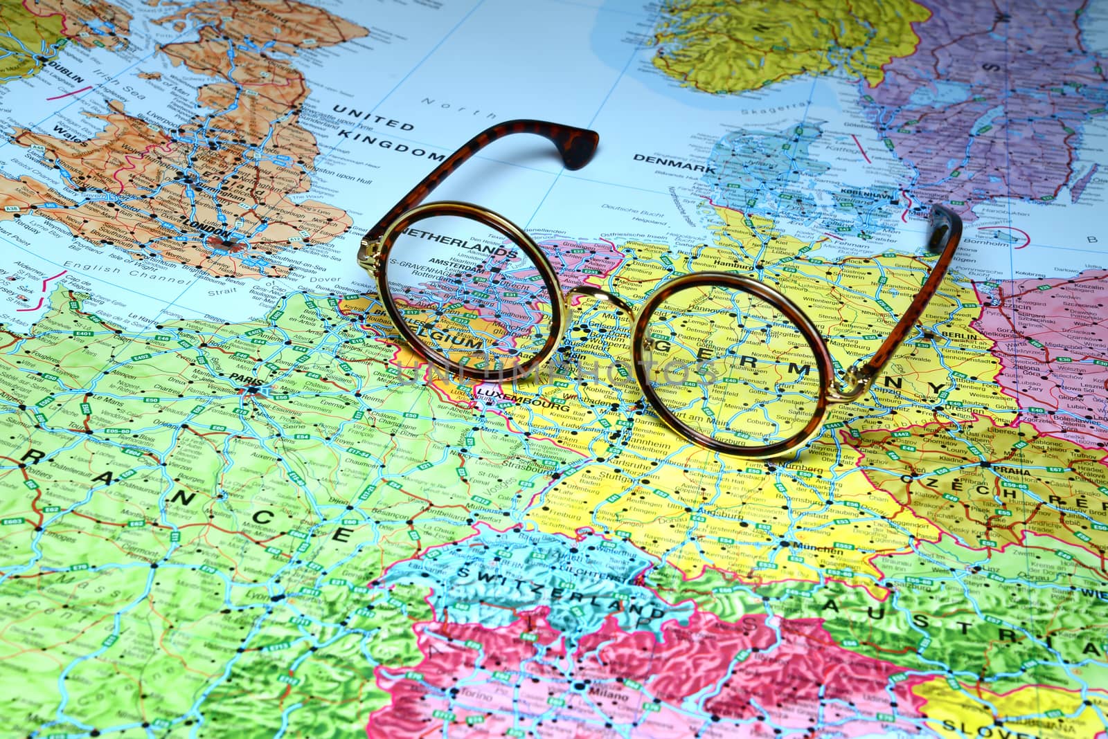 Photo of glasses on a map of europe. Focus on Germany. May be used as illustration for traveling theme.