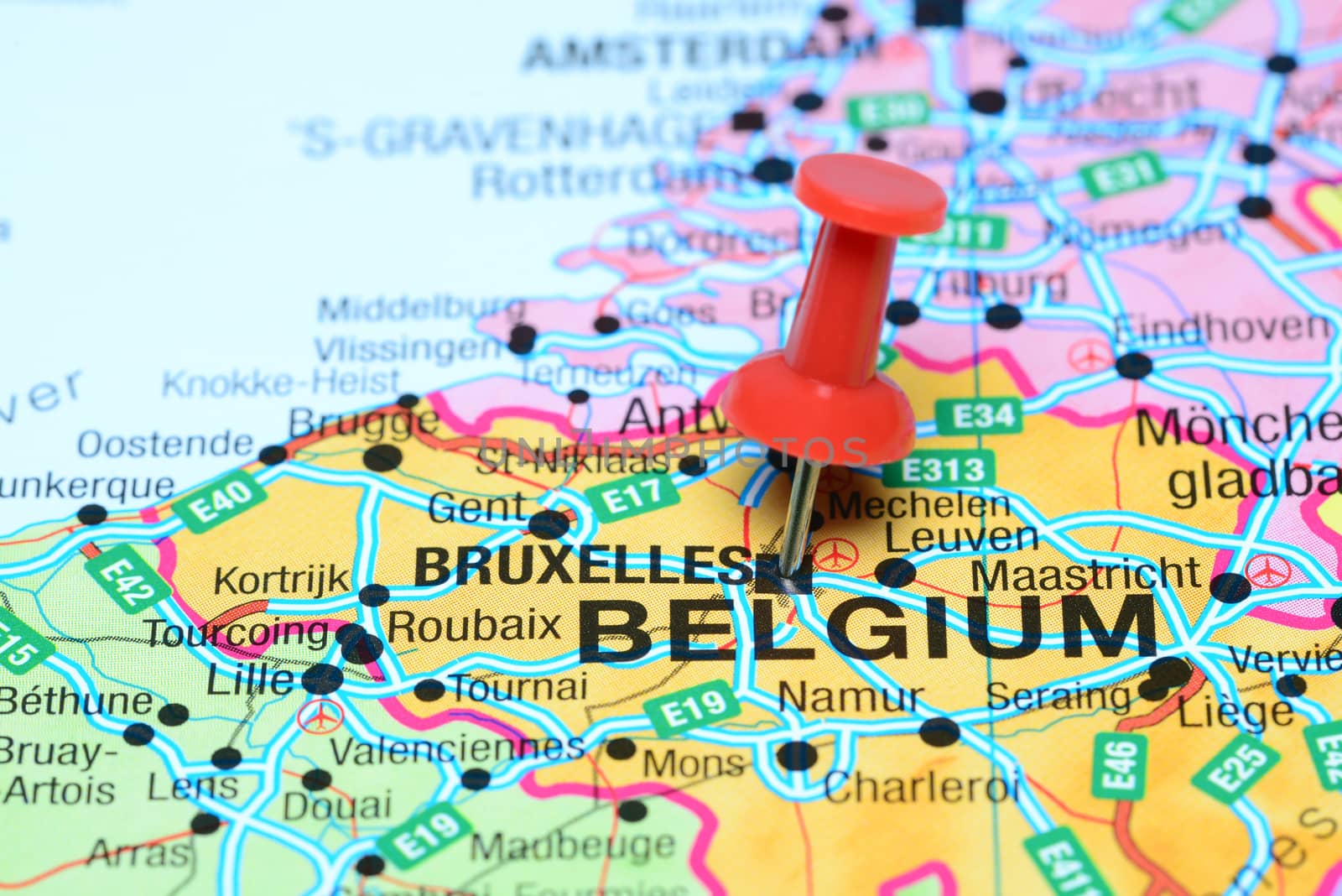 Photo of pinned Brussels on a map of europe. May be used as illustration for traveling theme.