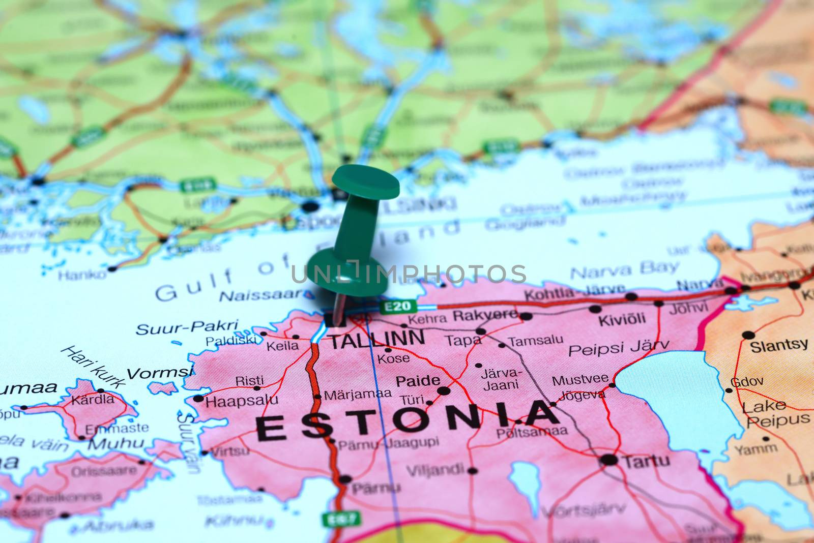 Photo of pinned Tallinn on a map of europe. May be used as illustration for traveling theme.