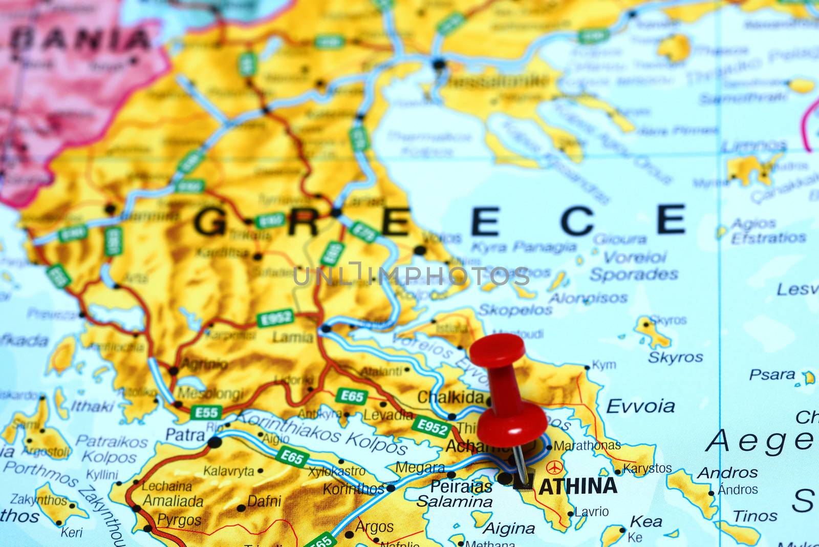 Photo of pinned Athens on a map of europe. May be used as illustration for traveling theme.