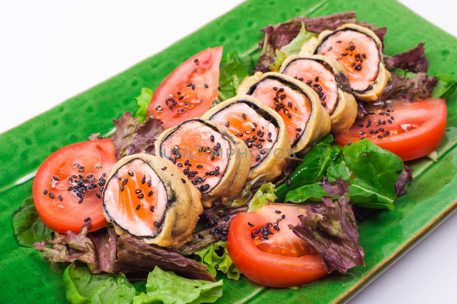 fried salmon roll on plate isolated on white background 