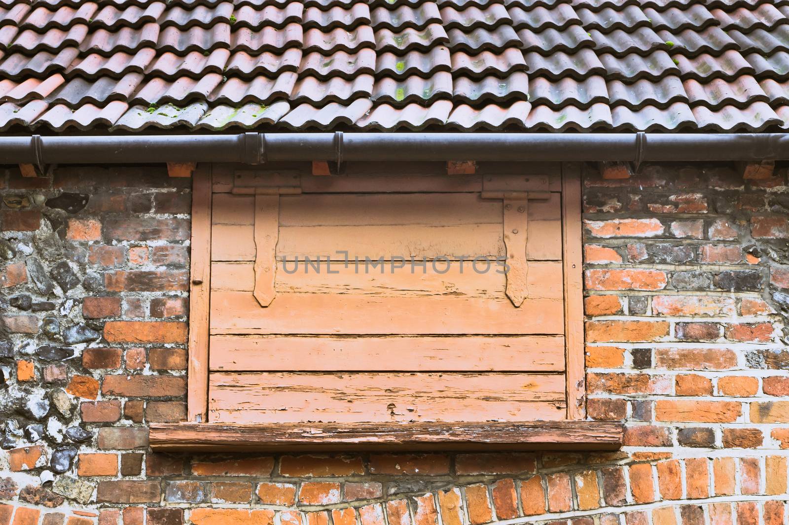 a wooden hatch door in an old building