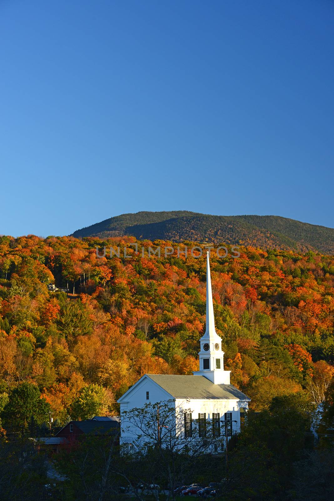 a church in autumn at stowe, vermont