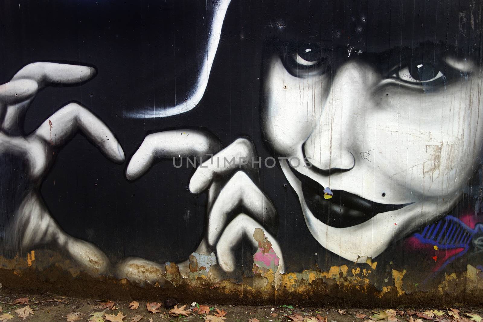 DRAMA, GREECE - OCTOBER 24: Colourful graffiti from unknown artists on a wall in the city, a new kind of art and demonstration, on October 24, 2014 in Drama, Greece