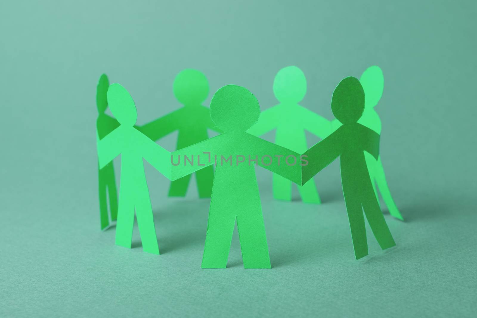 Paper team people linked together. Partnership concept