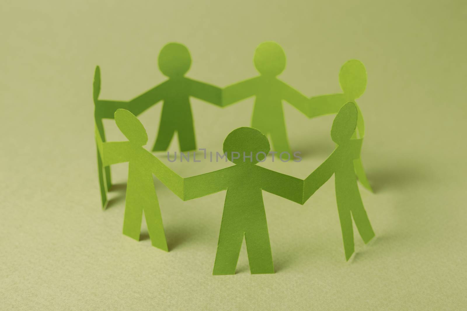 Paper team people linked together. Partnership concept