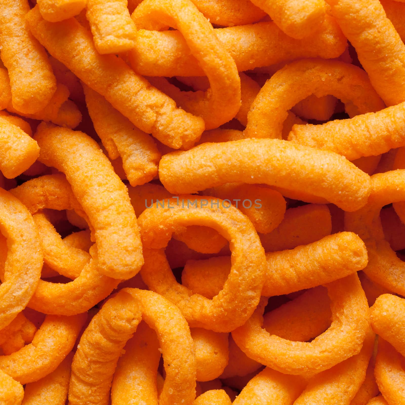 Closeup of cheese puffs. Fills the frame