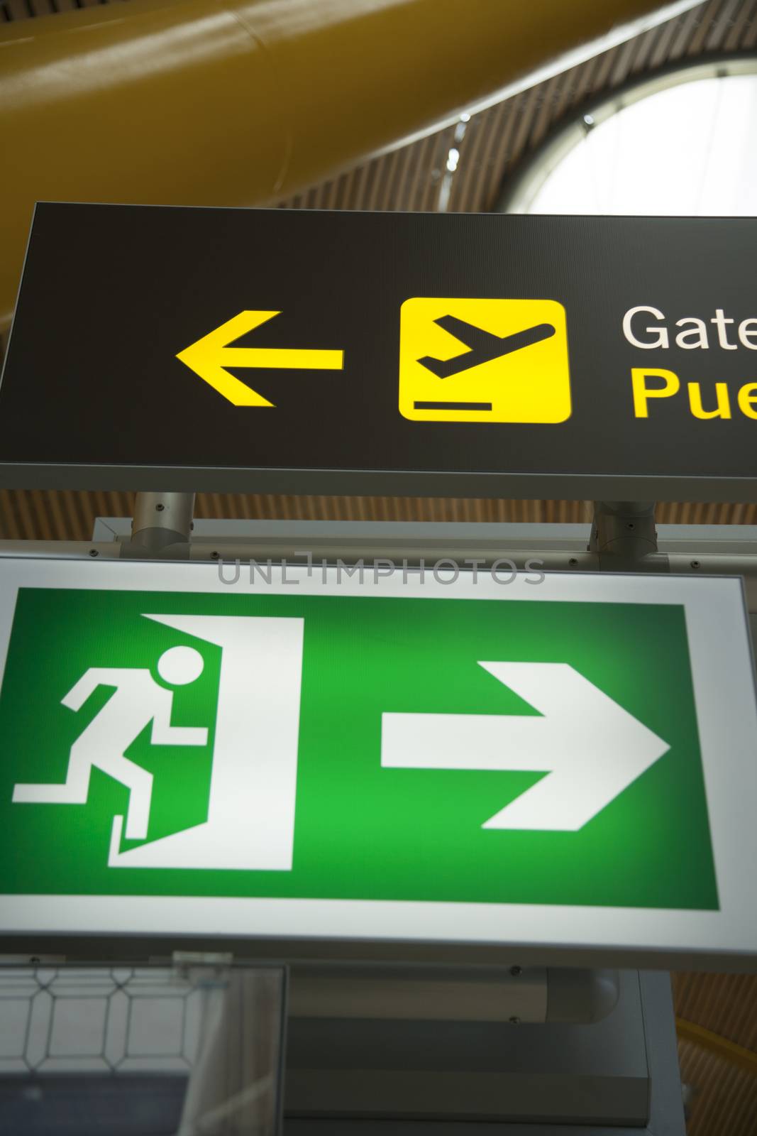 emergency exit and departure fly gate signals inside airport hall