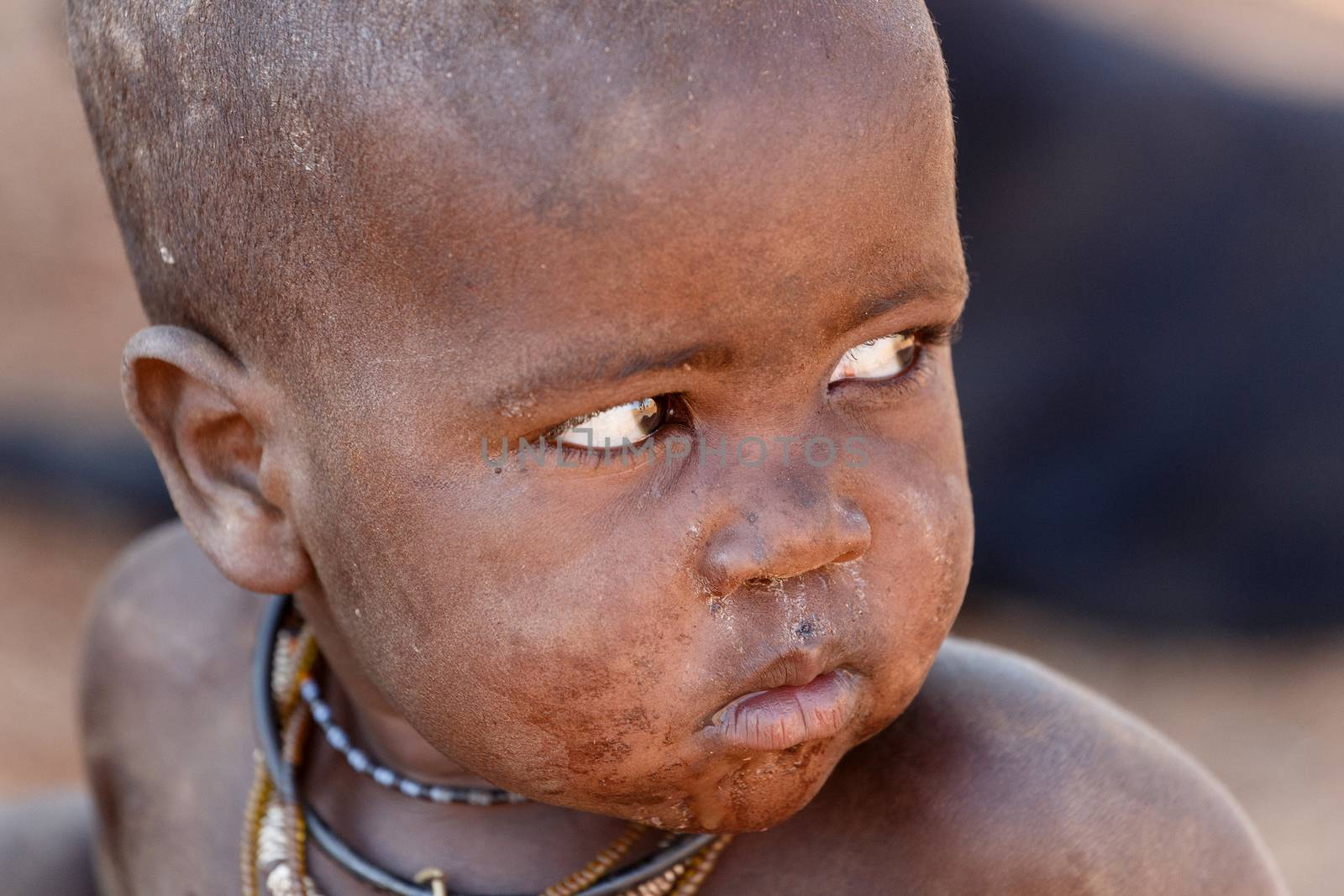 NAMIBIA, KAMANJAB, OCTOBER 10: Unidentified child Himba tribe. The Himba are indigenous peoples living in northern Namibia, in the Kunene region of South-West Africa on october 10 2014