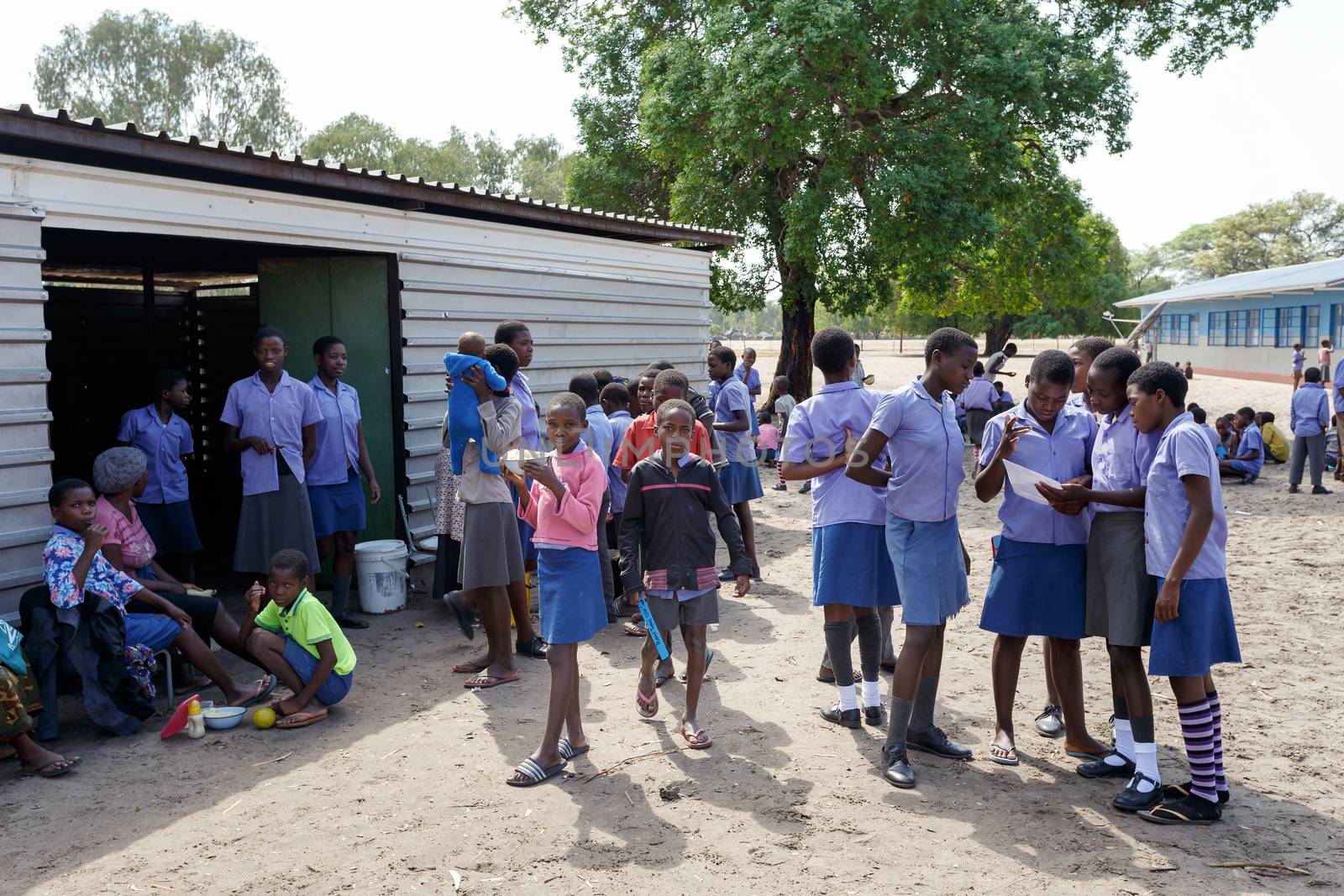 NAMIBIA, KAVANGO, OCTOBER 15: Happy Namibian school children waiting for a lesson. Kavango was the region with the highest poverty level in Namibia, more than 50% of the population were classified as poor. October 15, 2014, Namibia