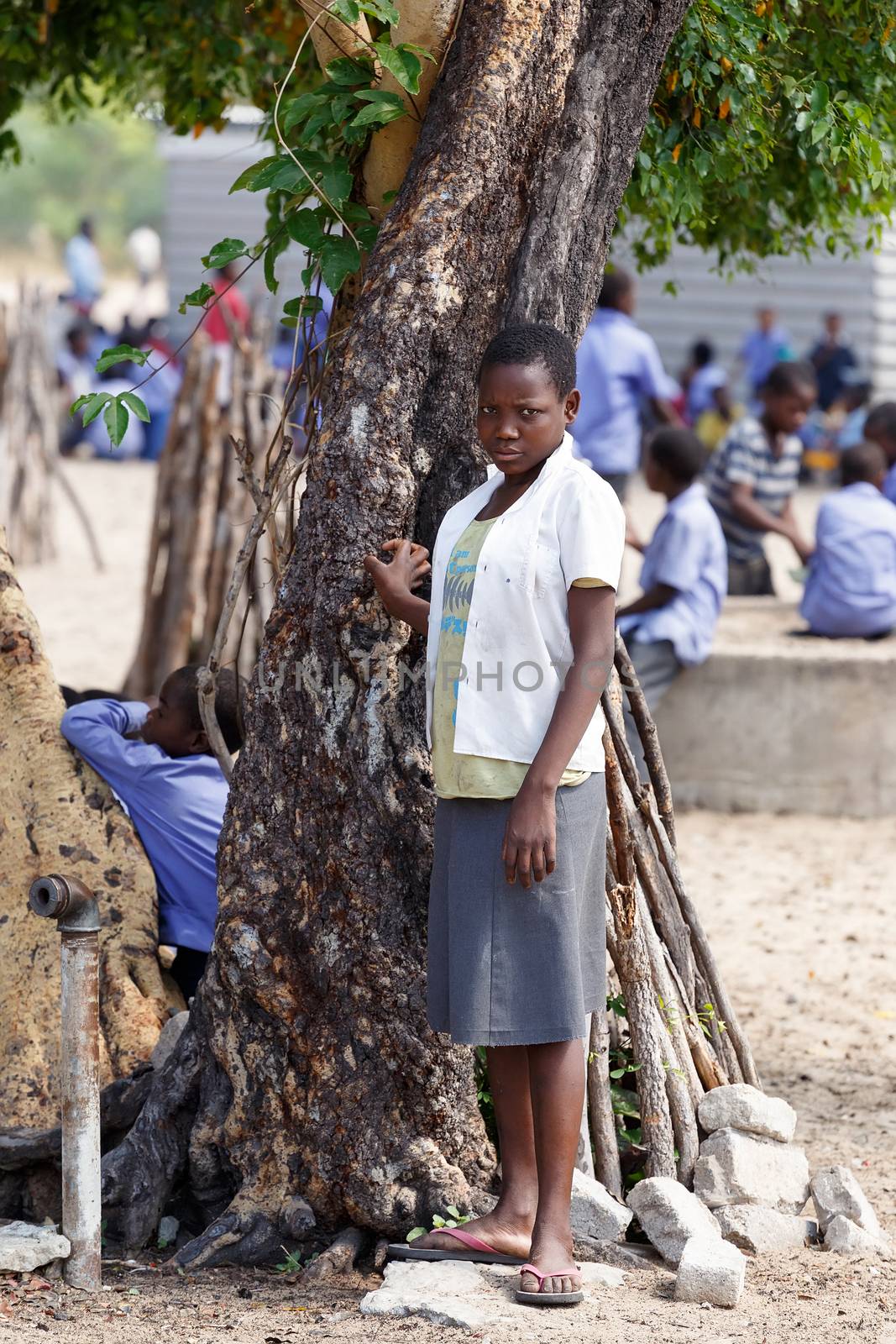 NAMIBIA, KAVANGO, OCTOBER 15: Happy Namibian school children waiting for a lesson. Kavango was the region with the highest poverty level in Namibia, more than 50% of the population were classified as poor. October 15, 2014, Namibia