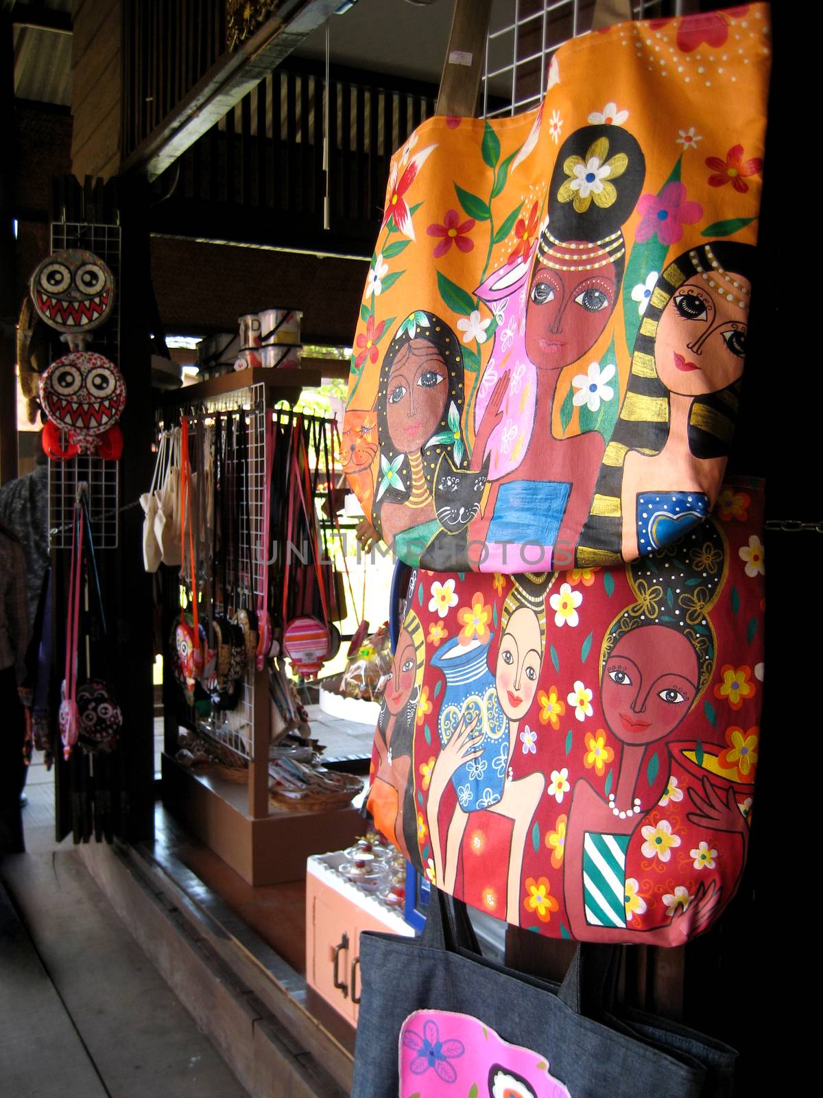 Colorful fabric bag for sell on wood wall in the ancient market in Asia.