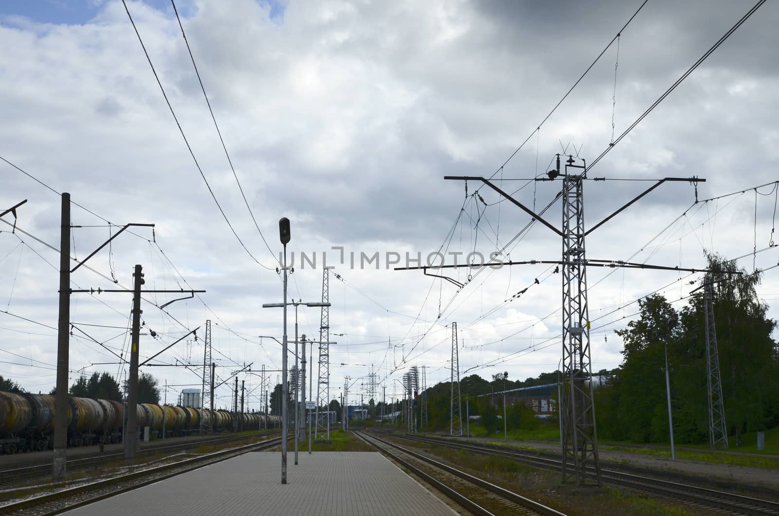 Photo of a railway station platform with electricity transmission system. Taken in Riga, Latvia.