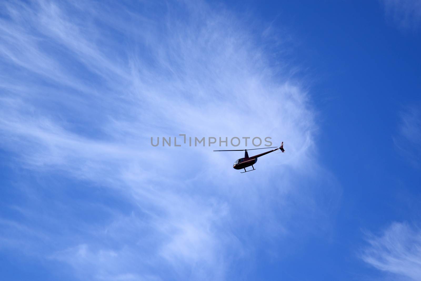 Photo of a helicopter in a blue sky. Taken in Sigulda.