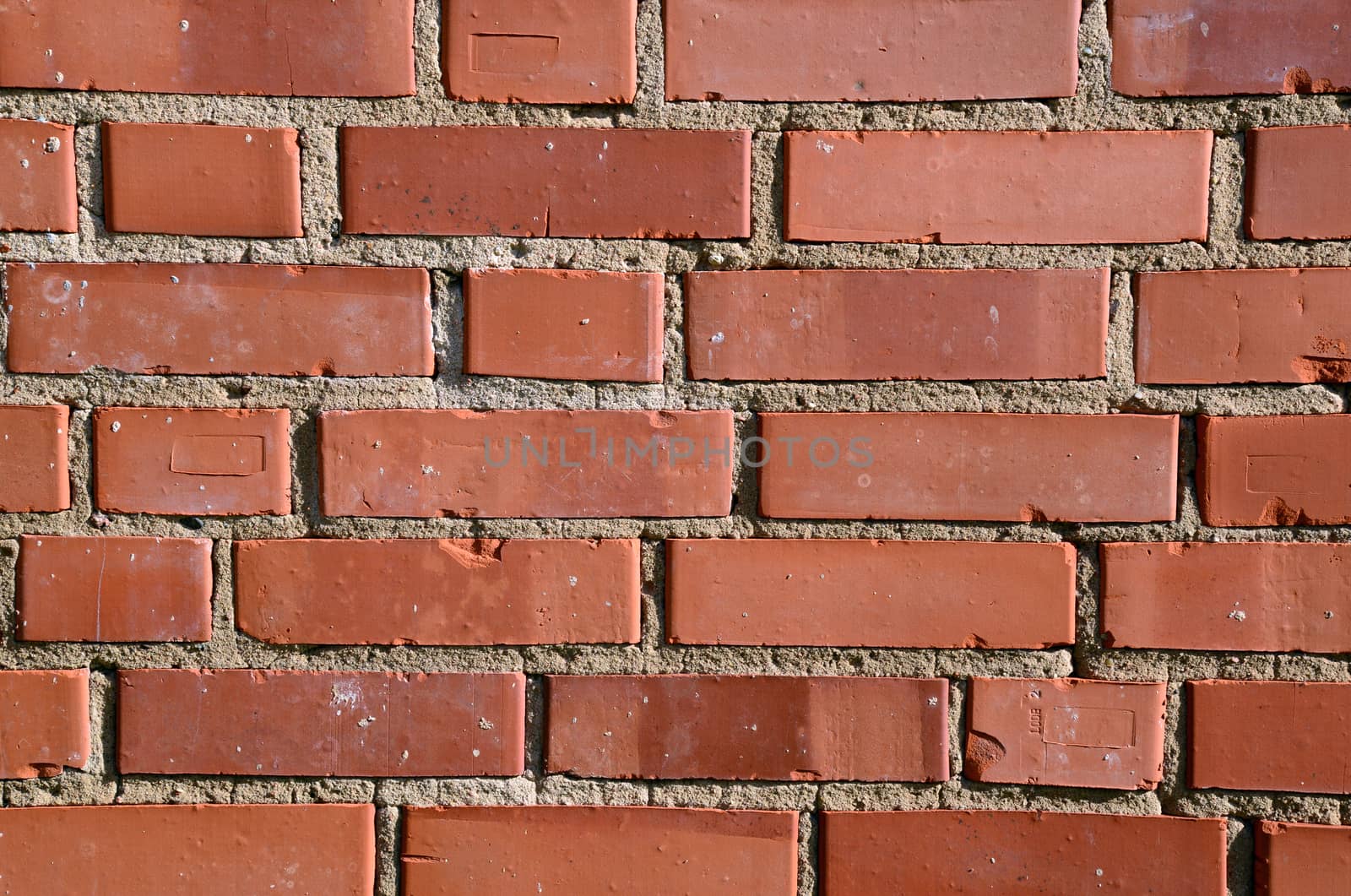 Photo of orange brick wall. May be used as texture or background.