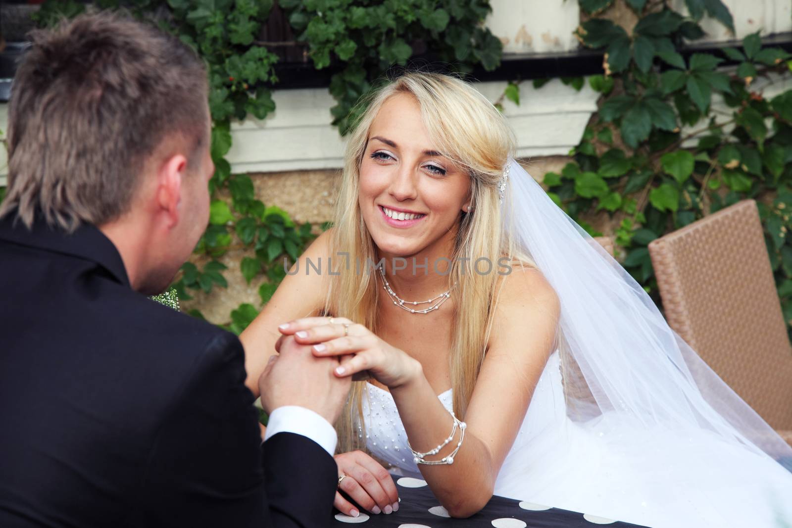 Bride and groom in the outside restaurant