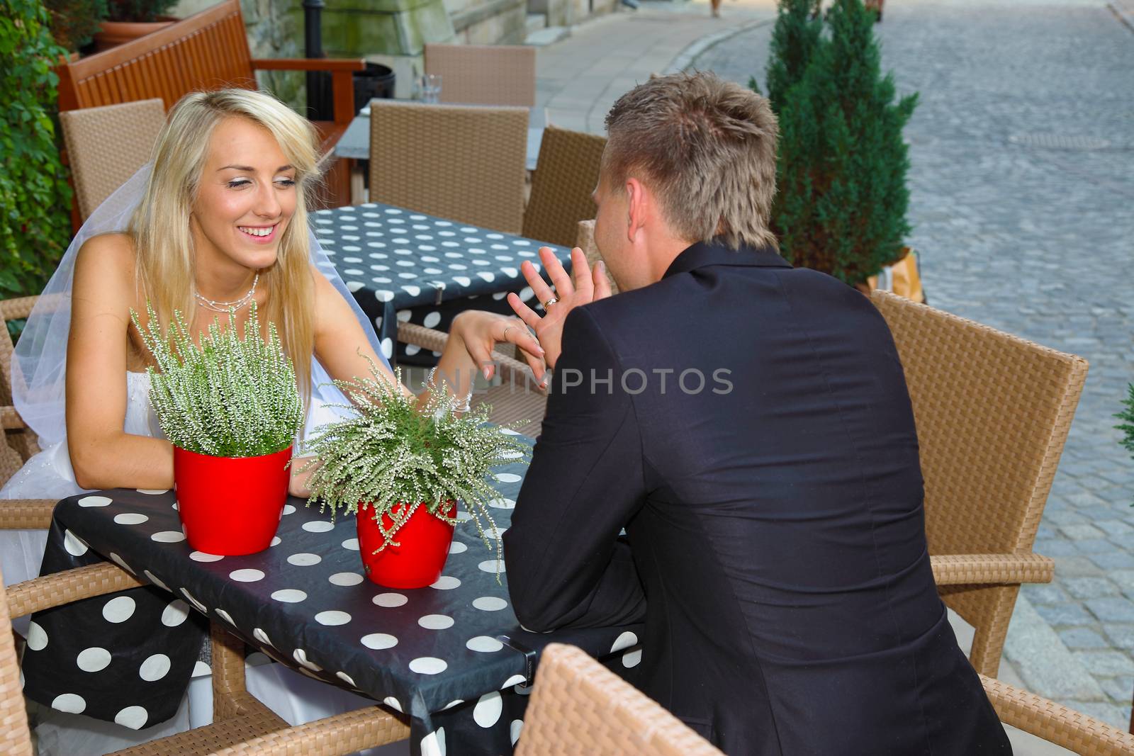 Bride and groom in the outside restaurant