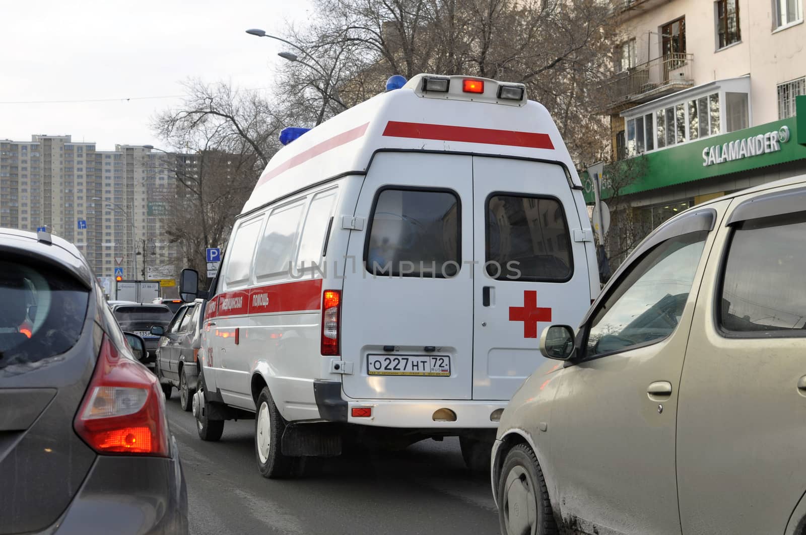 The ambulance car gets stuck in a traffic jam. Tyumen, Russia.