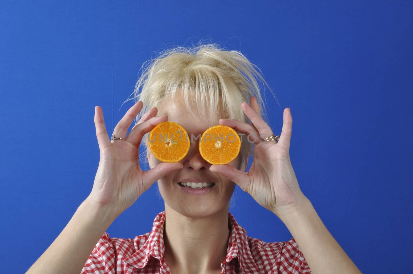 Portrait of womanwith a clementine