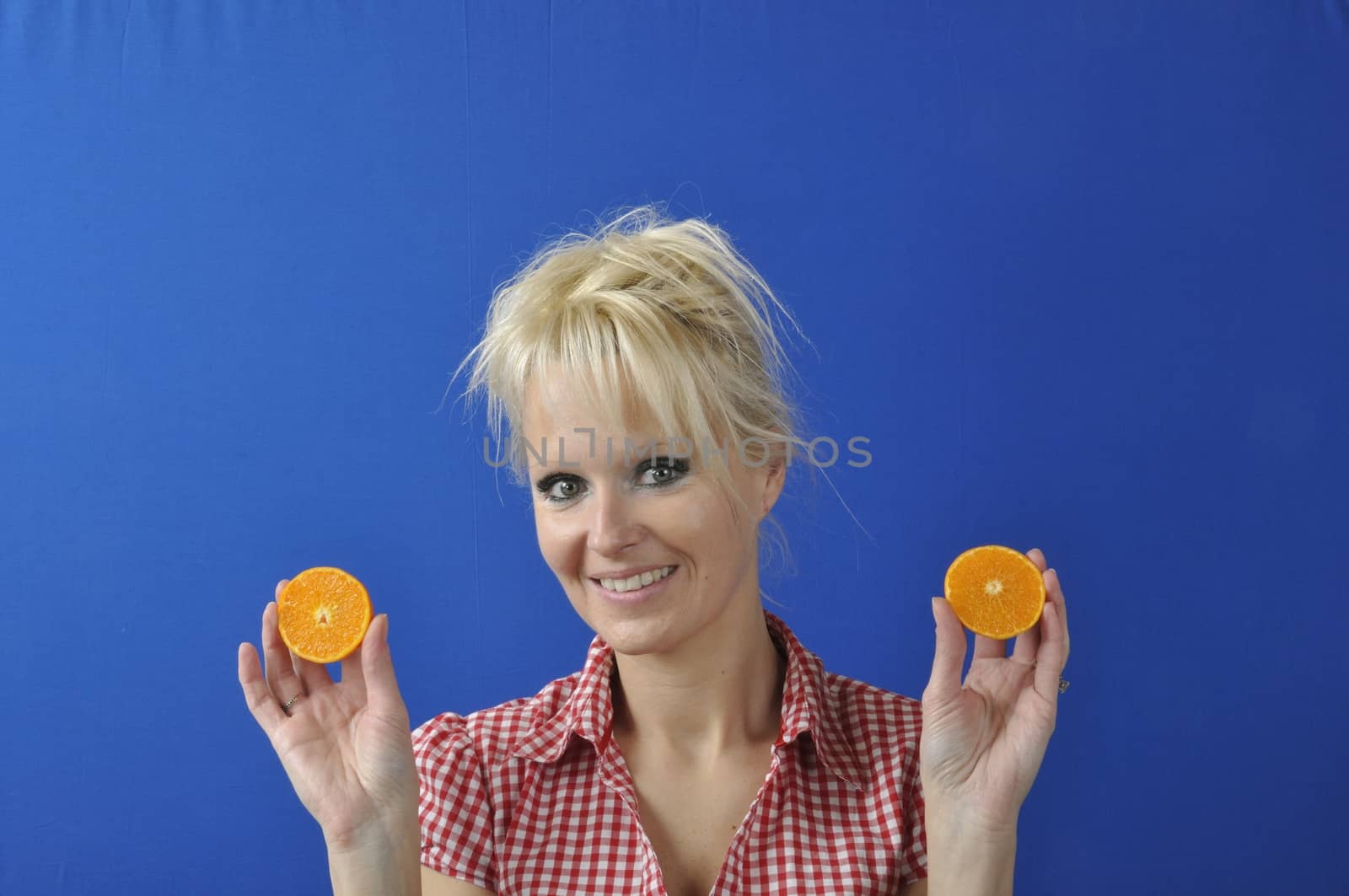 Portrait of womanwith a clementine