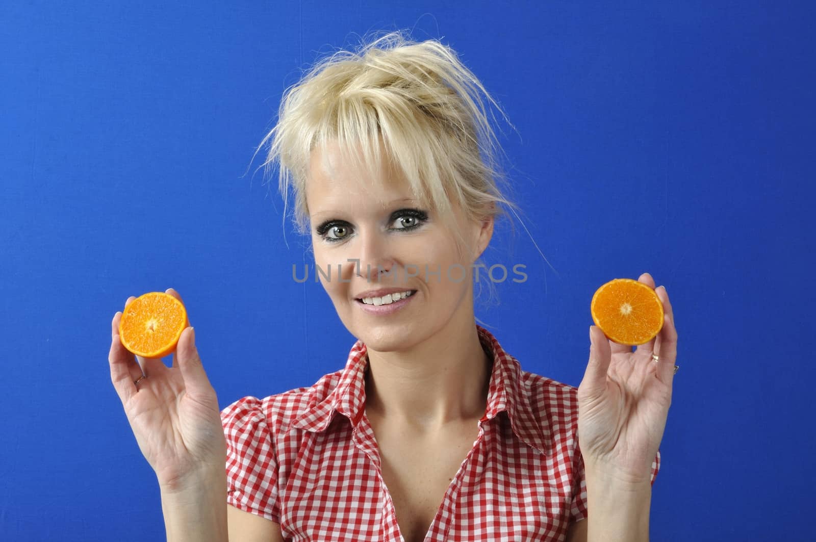 Portrait of womanwith a clementine