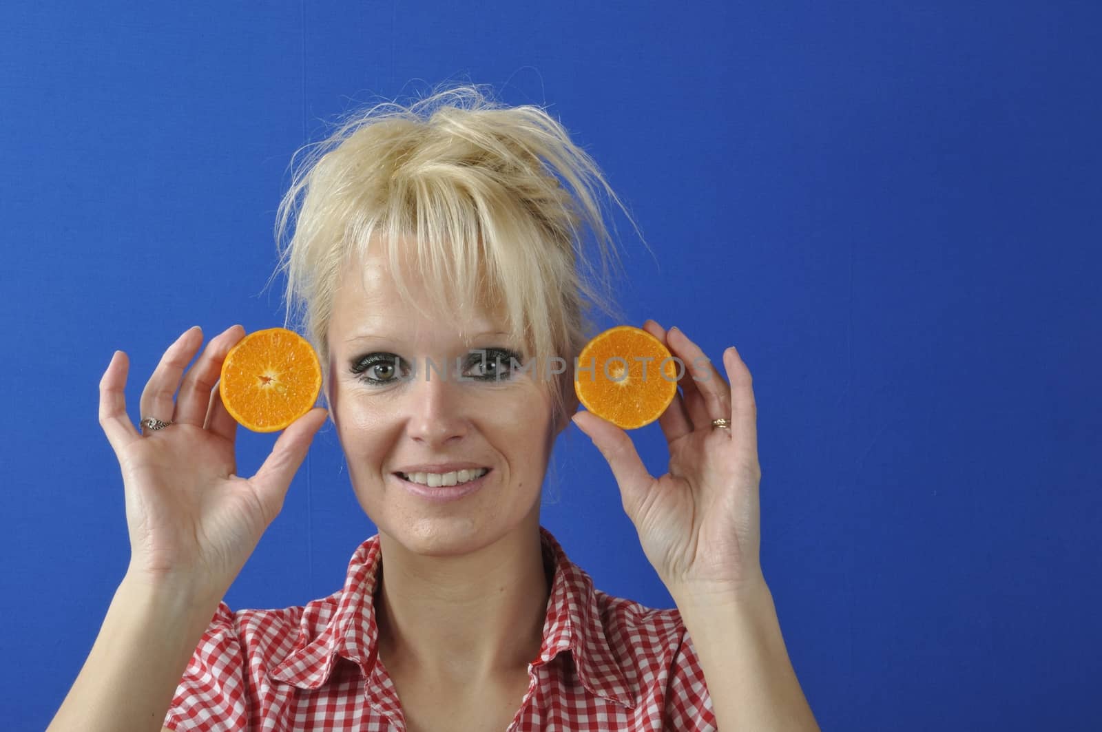 Portrait of womanwith a clementine