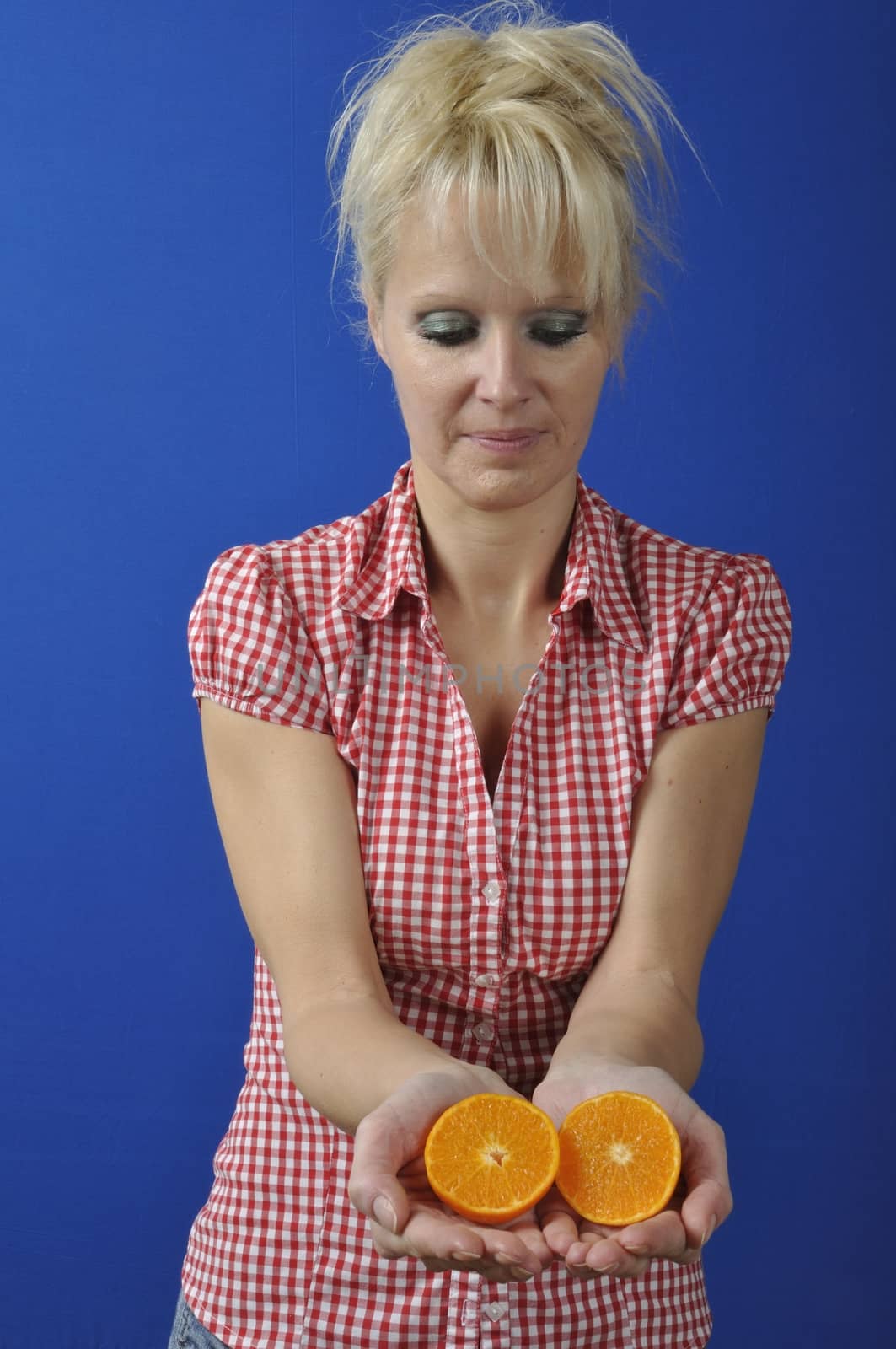 Portrait of womanwith a clementine