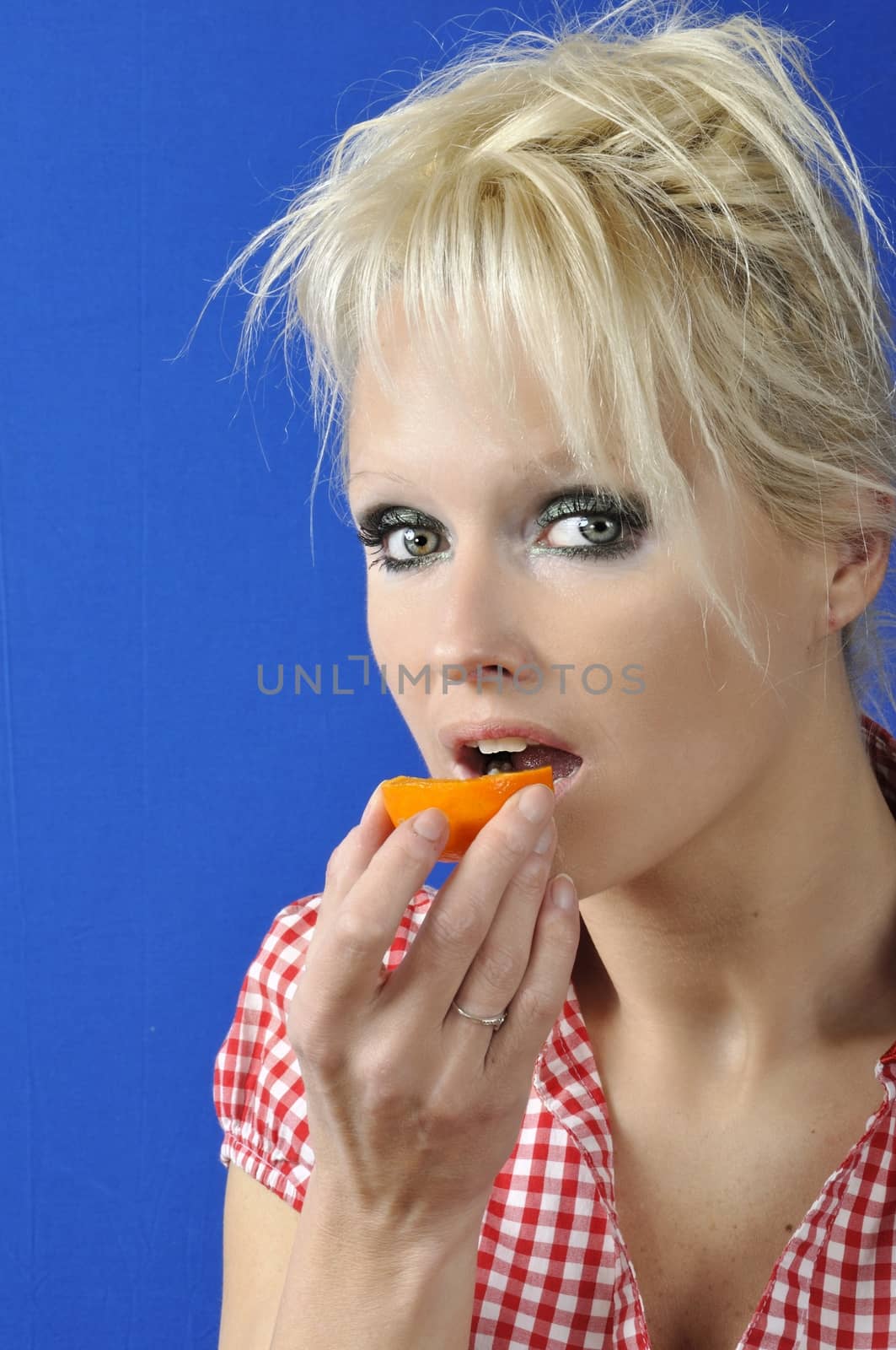 Portrait of womanwith a clementine