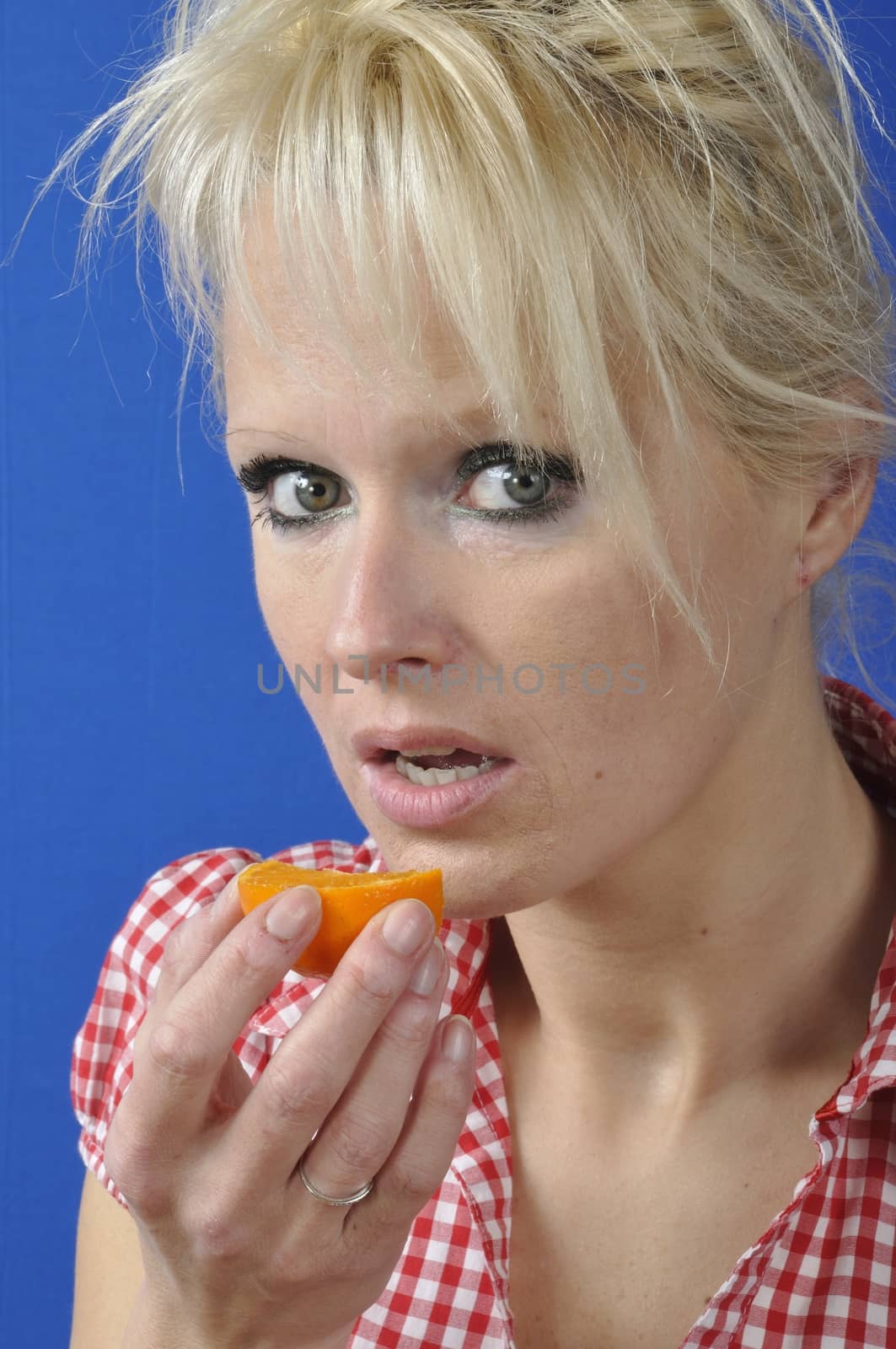 Portrait of womanwith a clementine