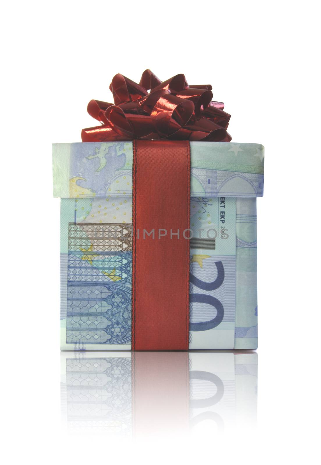 Gift box wrapped with euro banknotes with a red ribbon 