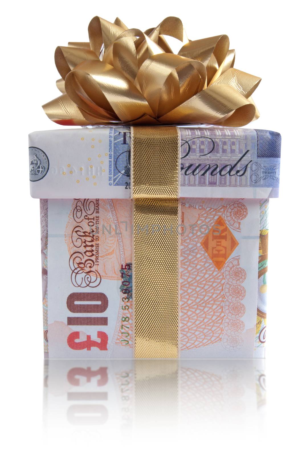 Gift box wrapped with sterling pound banknotes with a gold silk ribbon