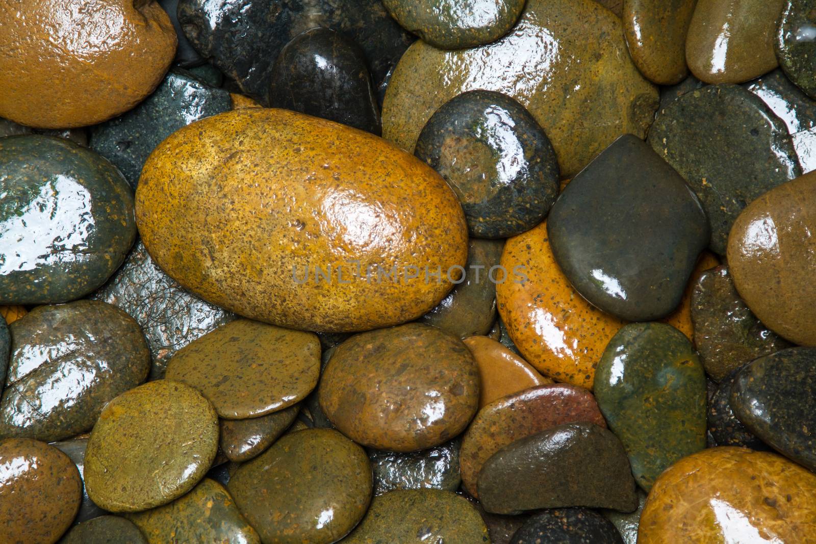 Pile of round peeble stones for background