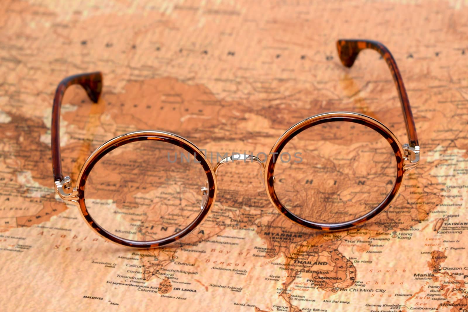 Glasses on a map of a world - China by dk_photos