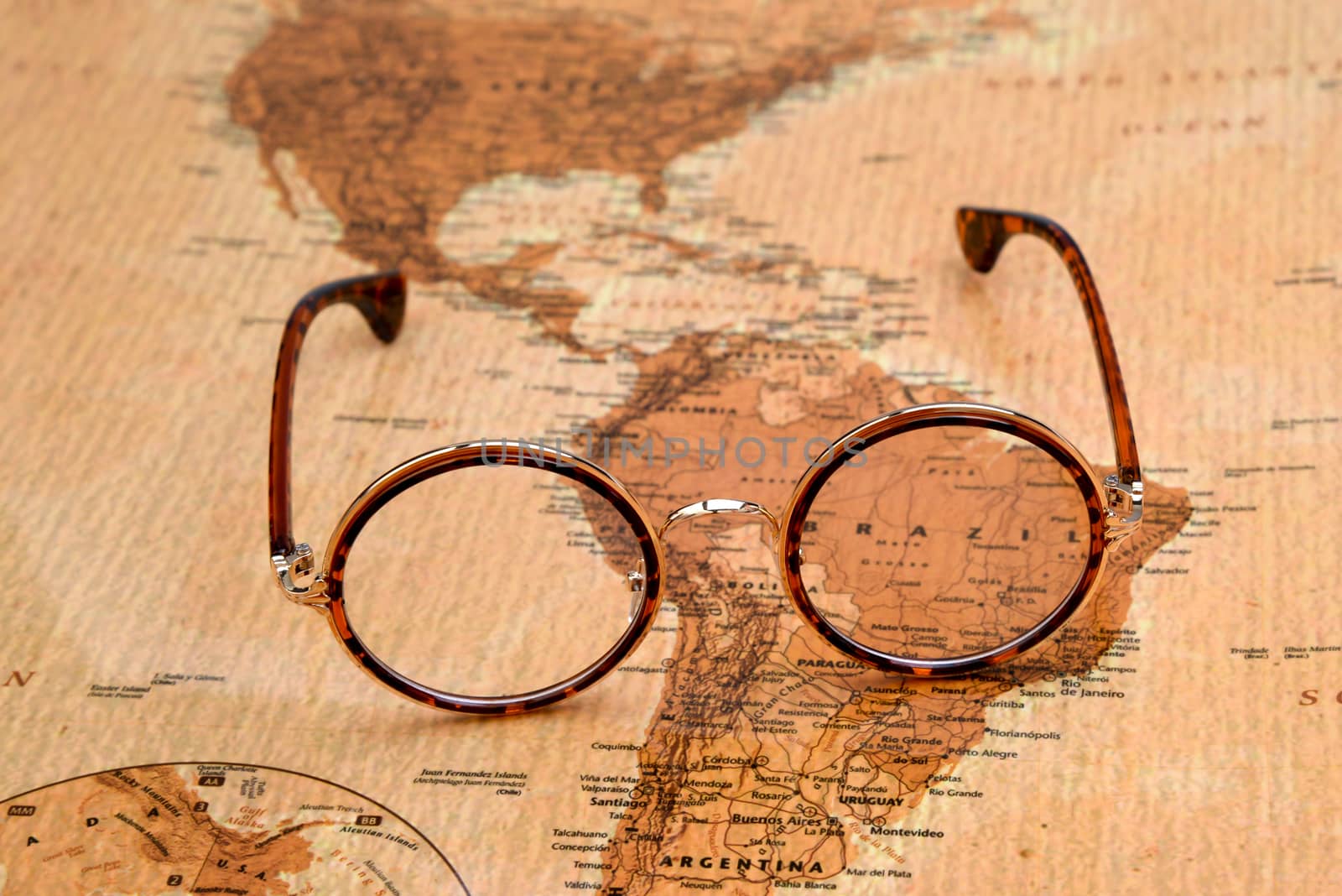 Glasses on a map of a world - Brazil by dk_photos