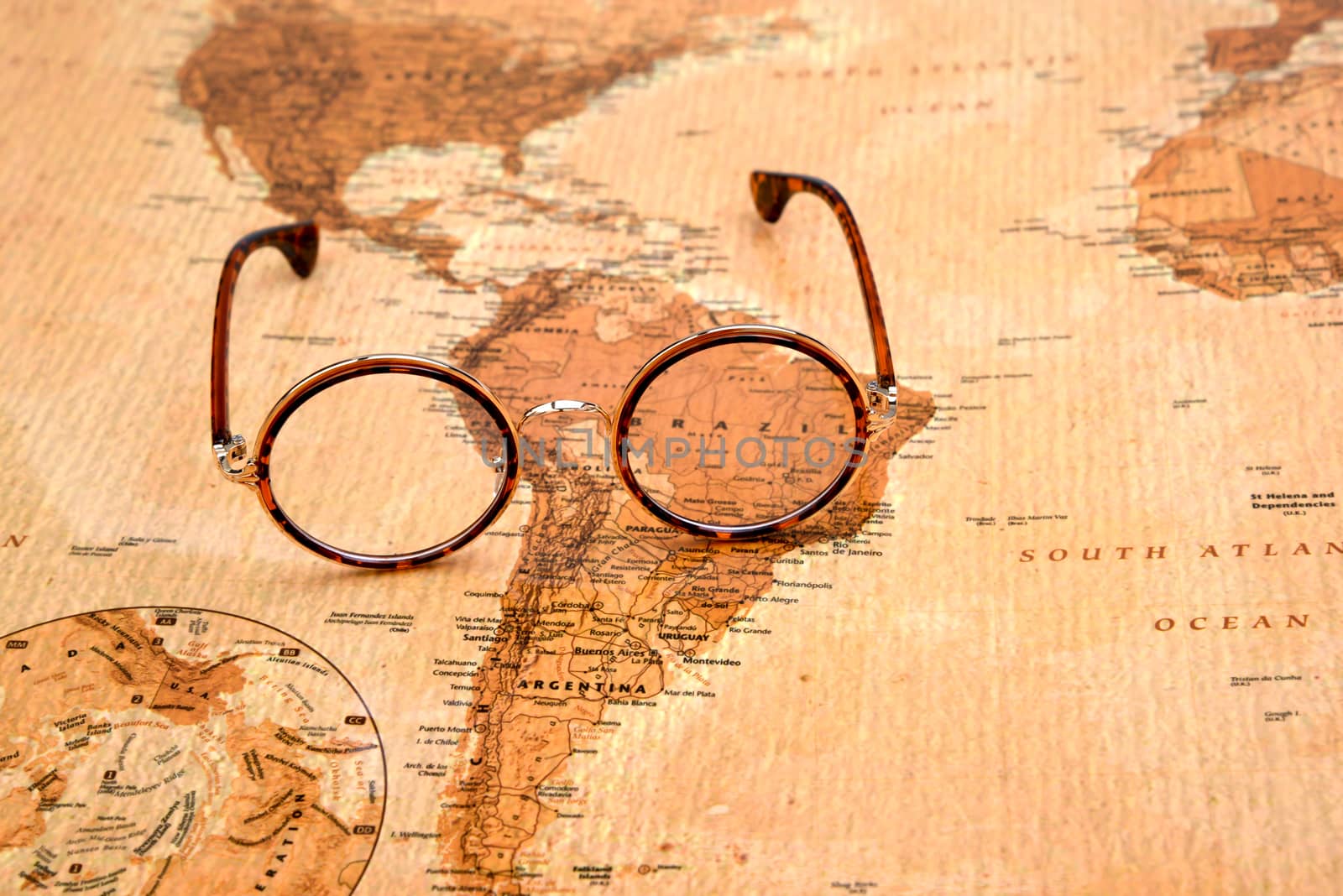 Glasses on a map of a world - Brazil by dk_photos