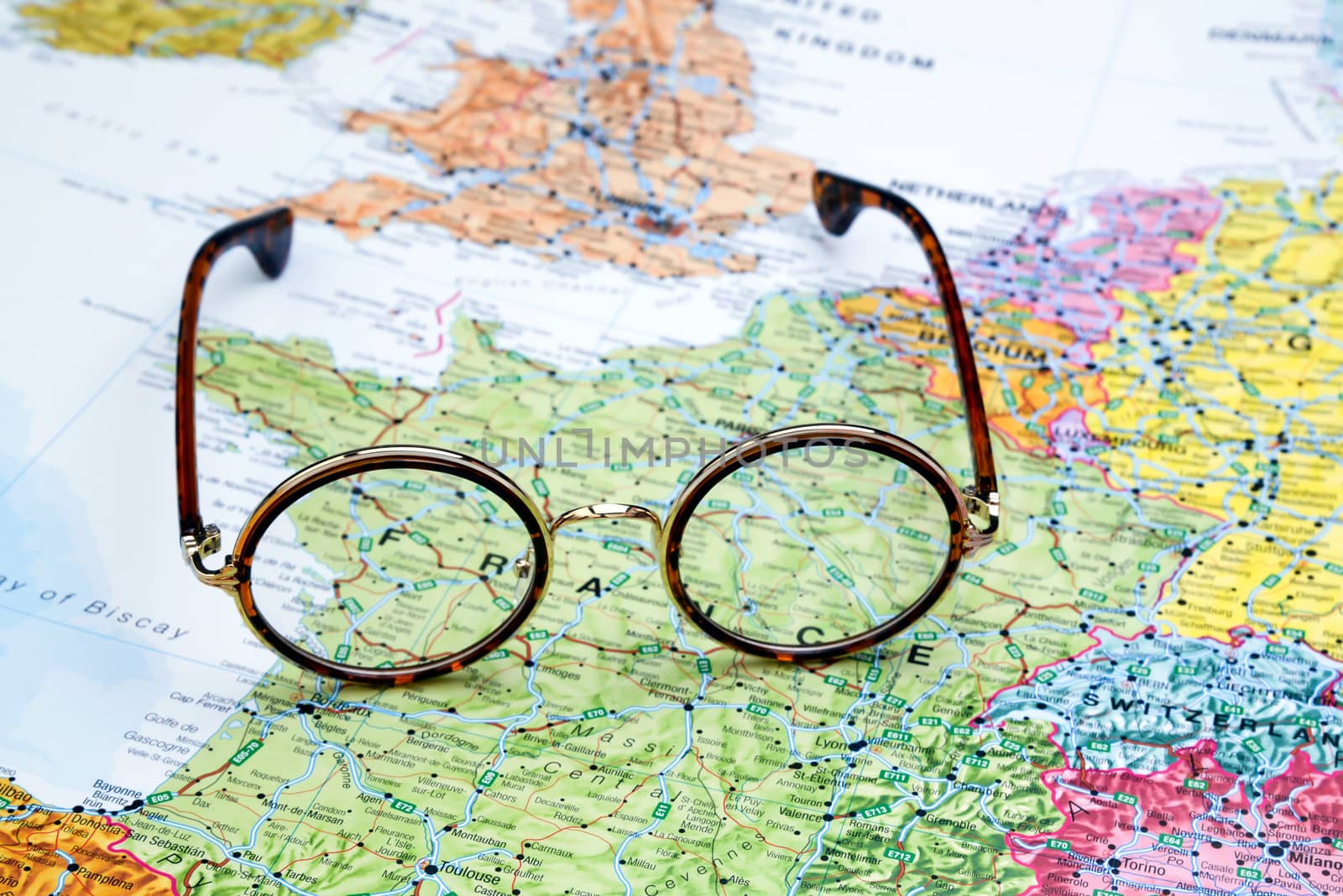 Glasses on a map of europe - France by dk_photos