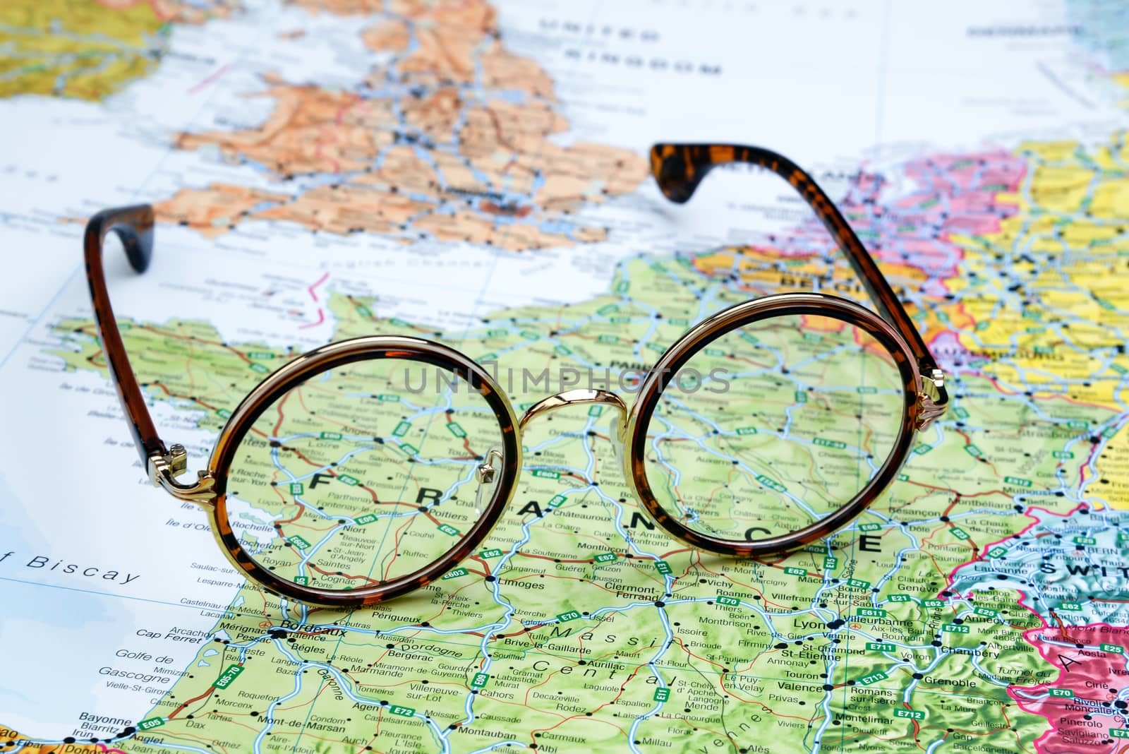 Glasses on a map of europe - France by dk_photos